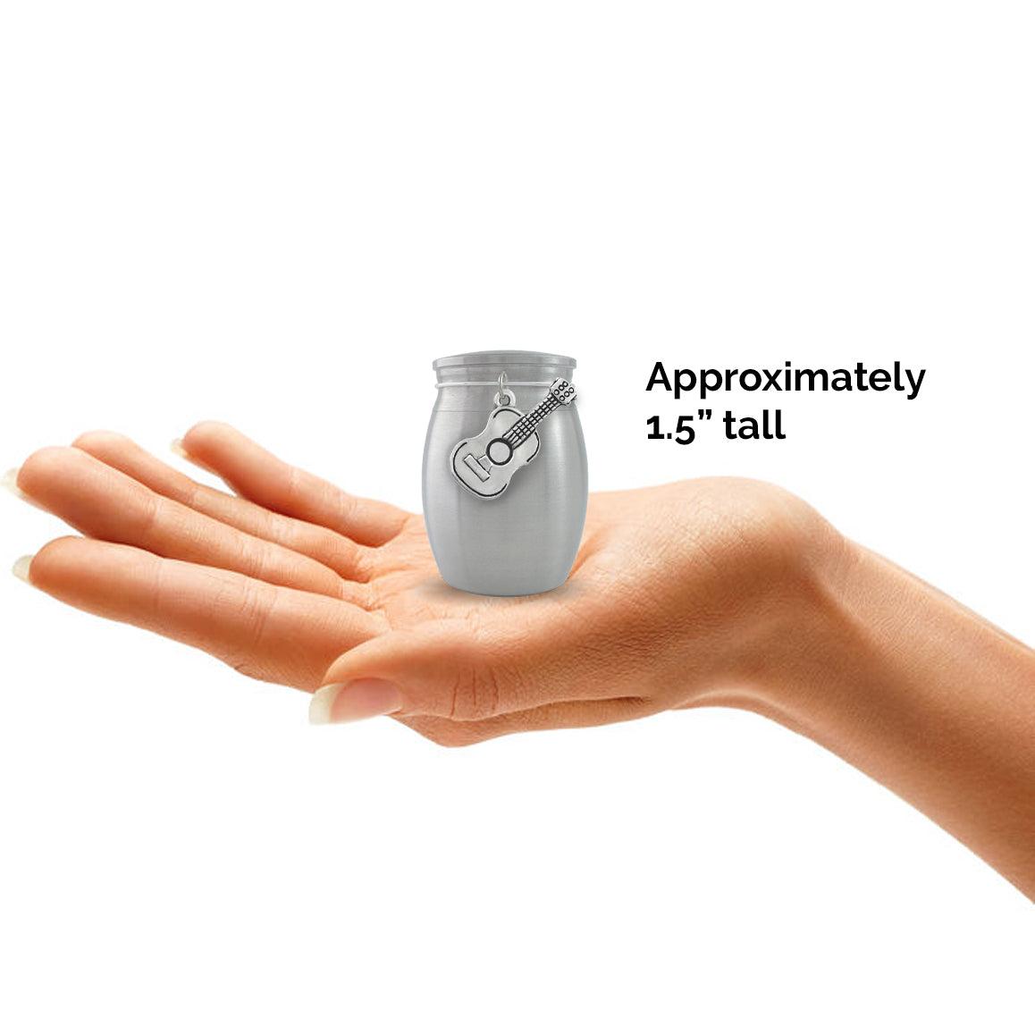 The small guitar urn measures approximately 1.5" tall. It is shown held in the palm of a hand.
