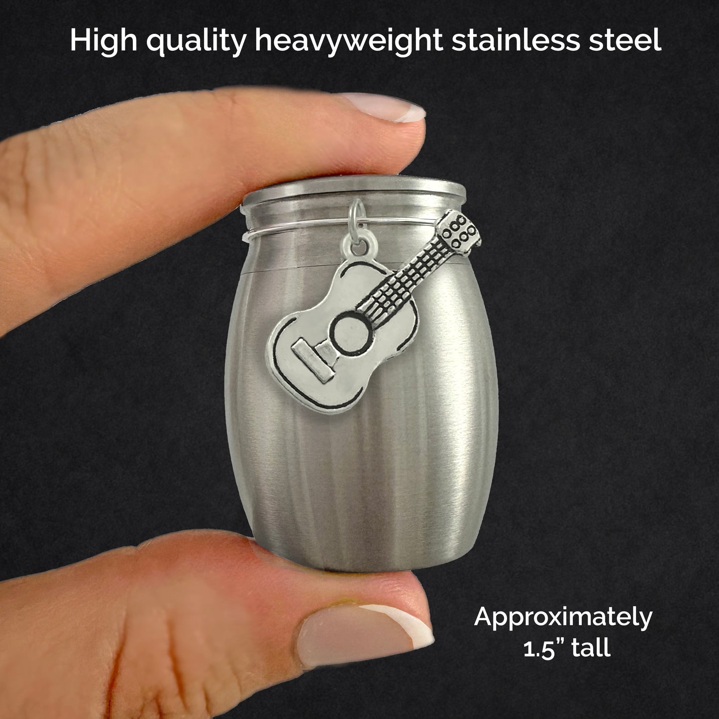 Small guitar themed urn for a musician or someone who played guitar. The mini keepsake urn holds a small amount of ashes. It is shown between two fingers with a guitar charm on the front of the urn to demonstrate the size of 1.5 inches tall.