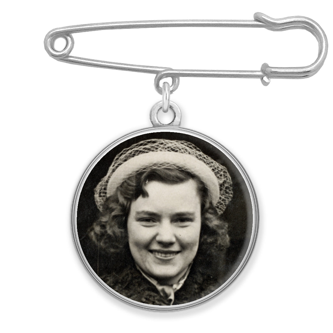 A memorial pin with a photo inside