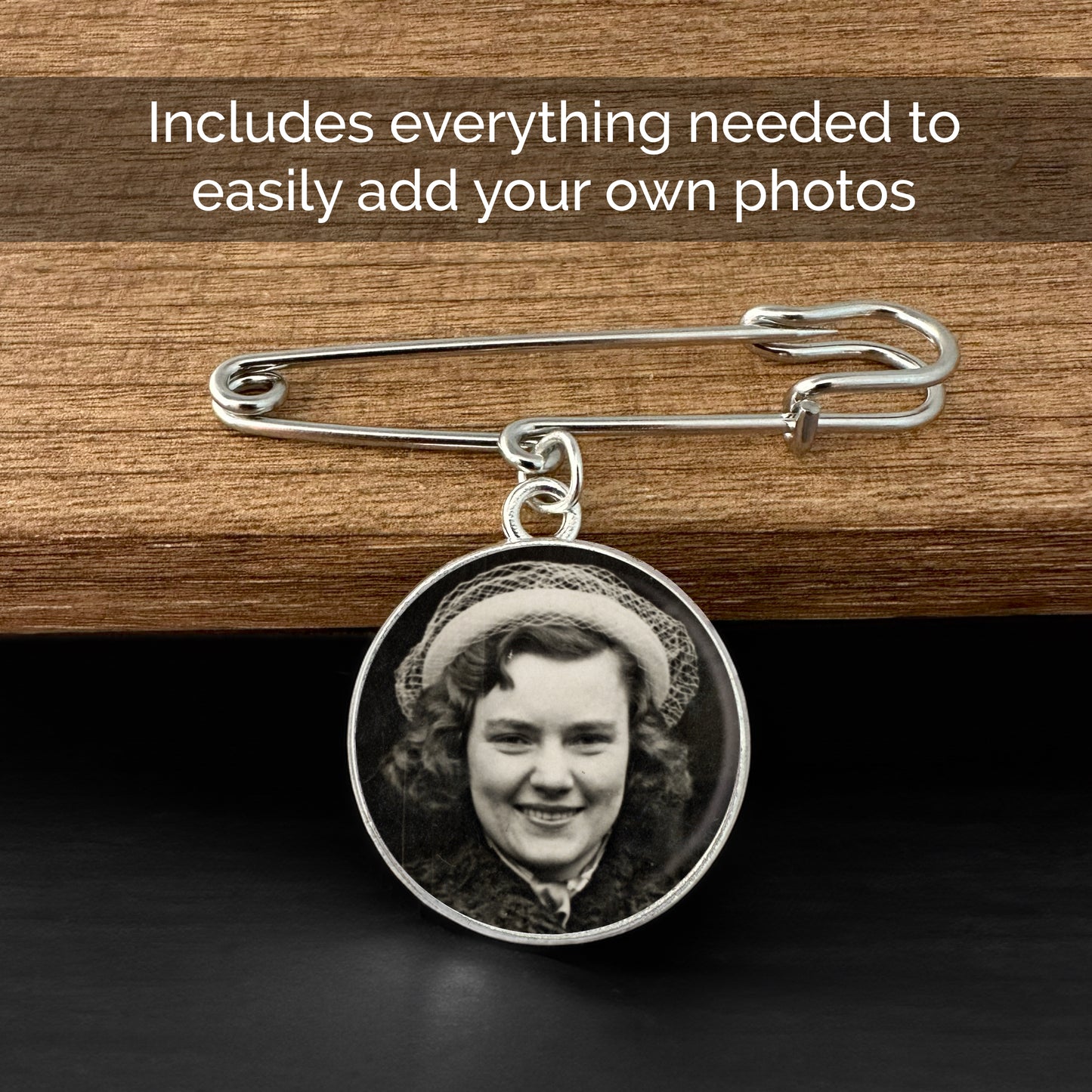 A double sided circle photo pin used for a wedding bouquet or boutonniere. It is shown on a wooden table with the text that reads Includes everything needed to easily add your own photos.