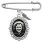 A silver wedding bouquet photo charm with safety pin style top featuring an oval filigree pendant with a black-and-white portrait photo in the frame and a small wing charm, shown on a plain white background.