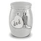 A silver cremation urn shaped like a small jar with a lid, featuring dangling charms: a heart-shaped charm engraved with 'dad' and a cowboy boot charm, shown on a white background.