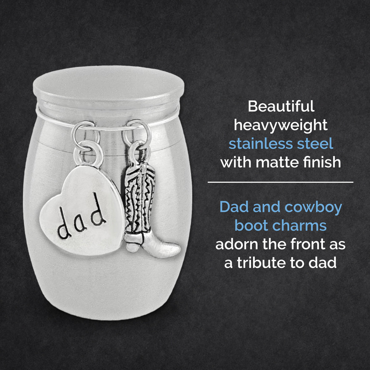 A silver-toned stainless steel keepsake jar with a matte finish, featuring a heart-shaped charm stamped with 'dad' and a cowboy boot charm, shown on a dark textured background with descriptive text.