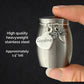 A hand holds a small brushed stainless steel keepsake urn, a heart-shaped charm engraved 'Grandma,' and a dragonfly charm. Text on the left reads 'High quality heavyweight stainless steel' and 'Approximately 1.5 inches tall'.