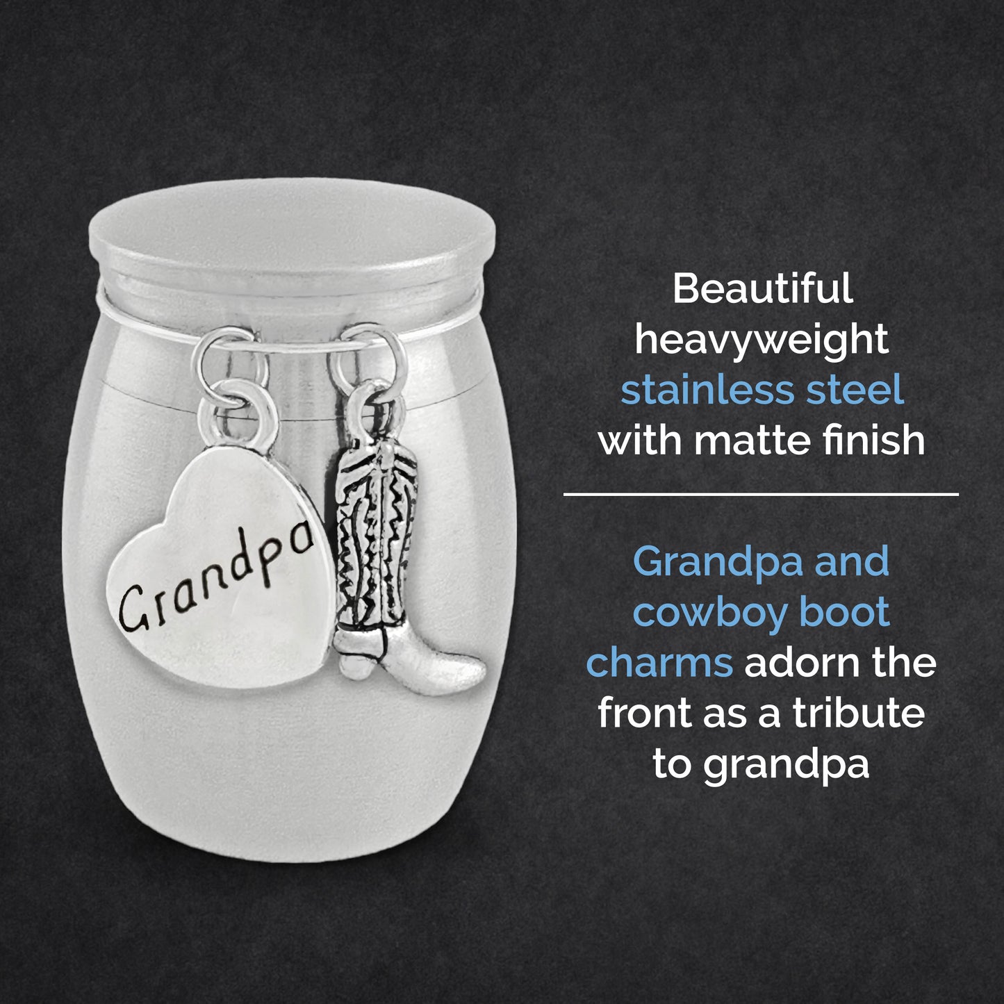 A silver small memorial urn jar with a matte finish, featuring engraved and shaped charms on the front: a heart charm reading 'Grandpa' and a cowboy boot charm. Text on a dark background describes the product as a stainless steel tribute jar with these charms.