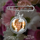 Chart showing the measurements of the memorial photo pin with angel charm. It measures 2.5" wide by 2" long. The photo size is a 25mm circle or approximately 1" in size. 