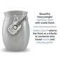 Miniature guitar urn ashes holder shown on a white background with the text "beautiful heavyweight stainless steel with matte finish. Guitar charm adorns the front as a tribute to someone who loved music and playing guitar".