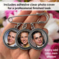 Silver photo pin with 3 charms shown in the palm of a hand to show size. Text banner reads "Includes adhesive clear photo cover for a professional look". Second text reads "easily add your own photos".