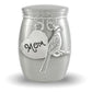 A silver cremation urn shaped like a small jar, featuring a heart-shaped charm engraved with 'Mom' and a cardinal charm, shown on a white background.