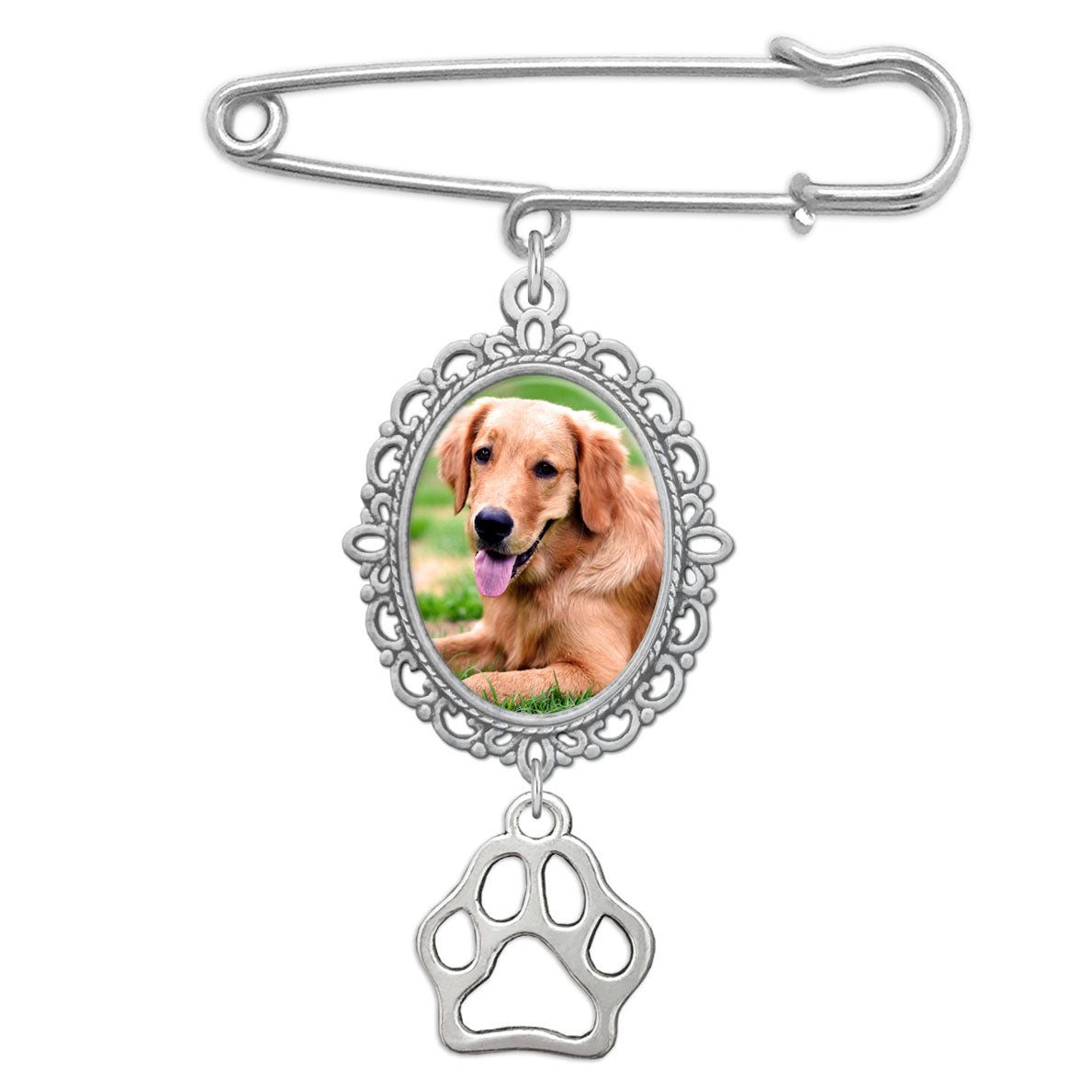 Silver brooch with a photo of a dog and a paw print on a white background