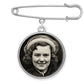 A memorial pin with a photo inside