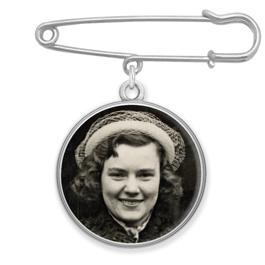 A memorial pin with a photo inside