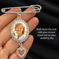 A silver rhinestone photo wedding pin with an oval photo frame and dangling heart charm, held in a hand against a dark satin background. The sample photo insert shows a smiling woman, and the text reads: 'Walk down the aisle with your missed loved one on your wedding day.