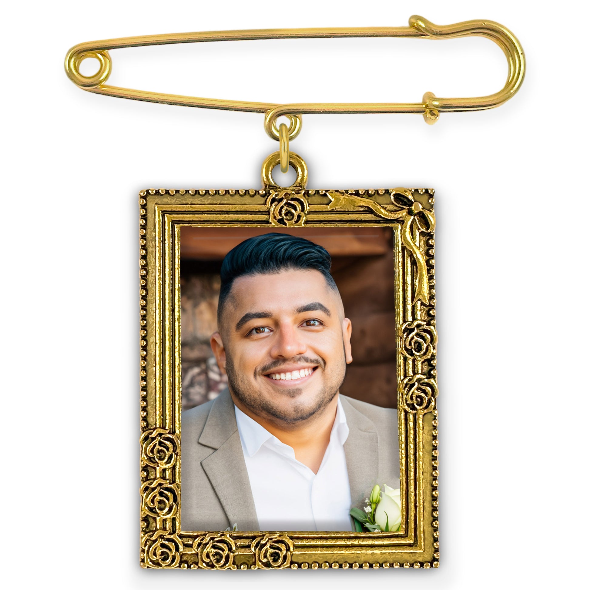 Gold-framed photo pin with a man's portrait on a white background